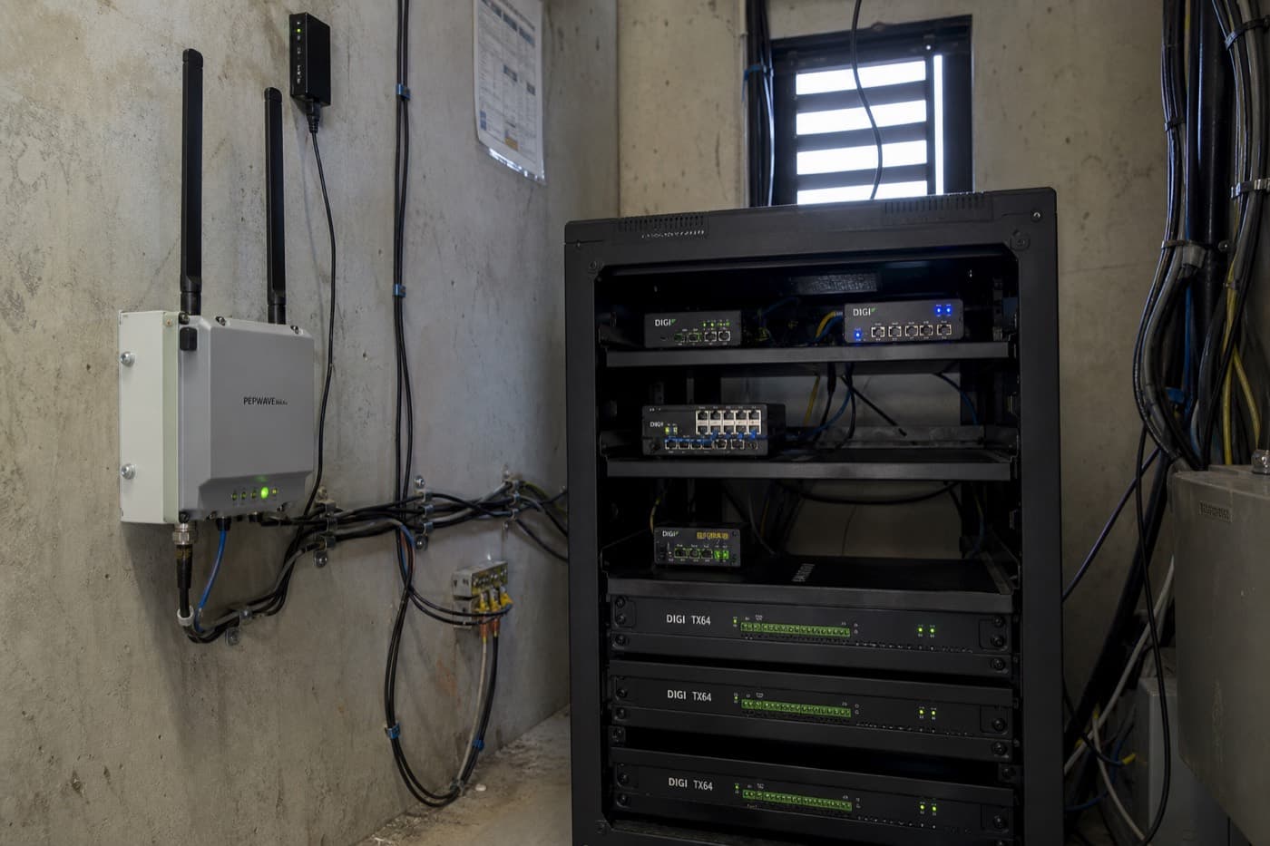 Remote field site utility room with edge gateway appliances and status LEDs